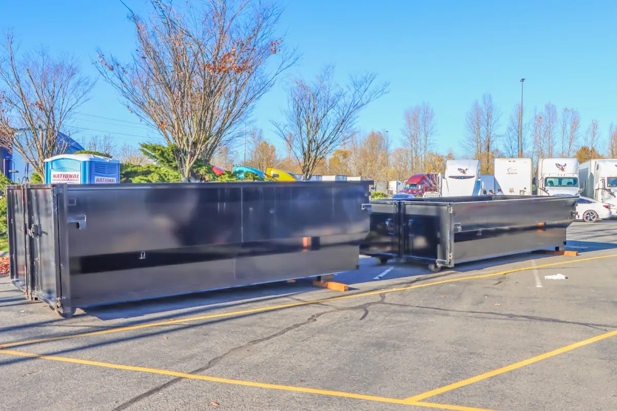 Professional dumpster rental service with roll-off container on residential driveway in Kathleen